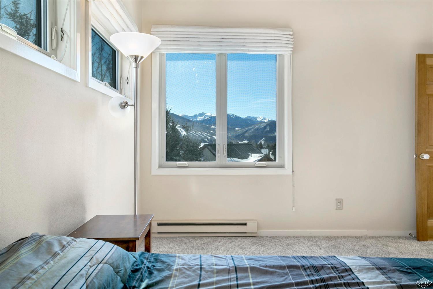 2613 Bear Trap Road Avon, CO 81620 - Photo 20 of 25 a view of a bedroom with a bed and the window