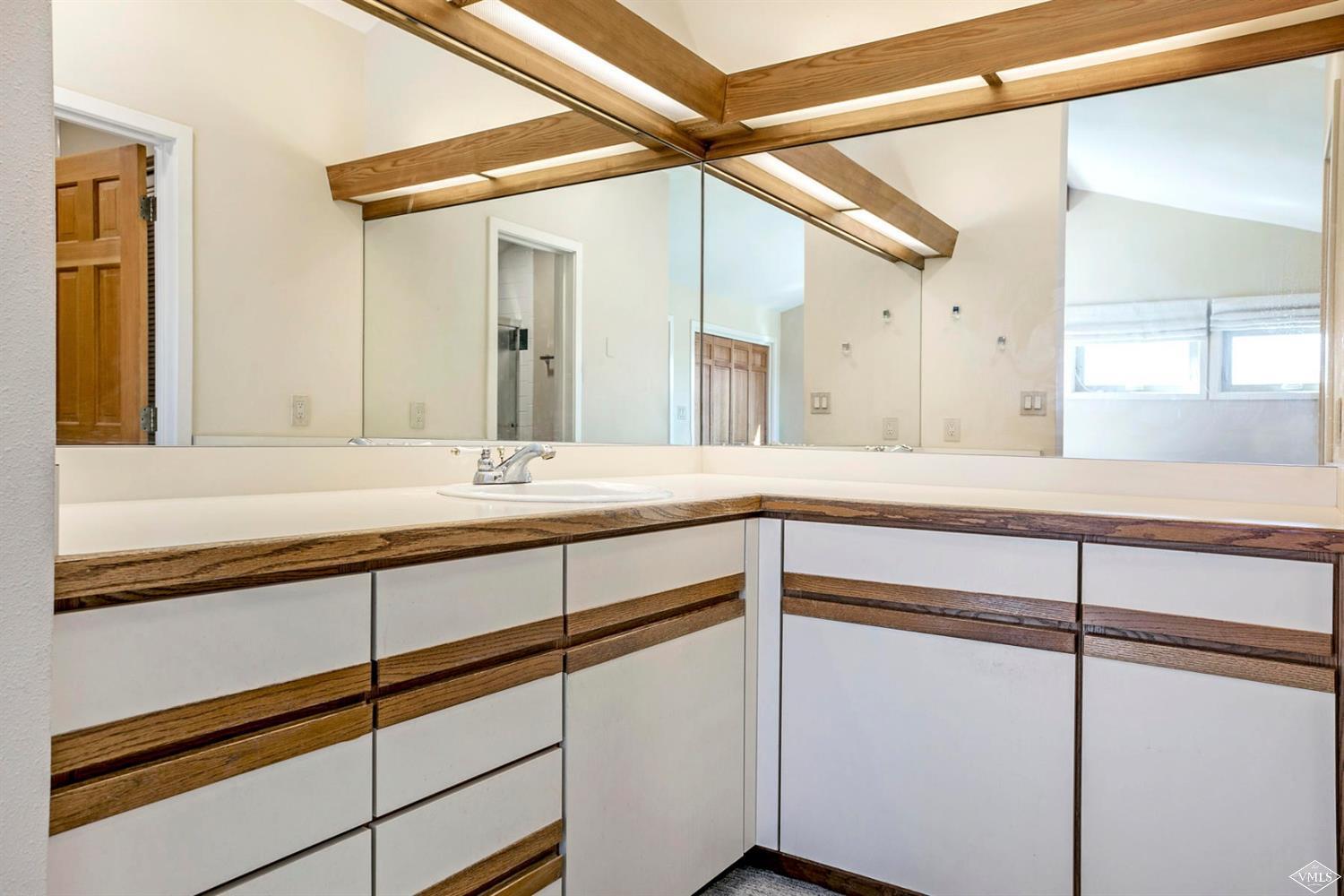 2613 Bear Trap Road Avon, CO 81620 - Photo 21 of 25 a bathroom with a sink and a mirror