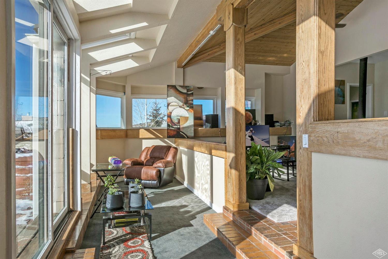 2613 Bear Trap Road Avon, CO 81620 - Photo 5 of 25 a view of a chairs and table in a balcony