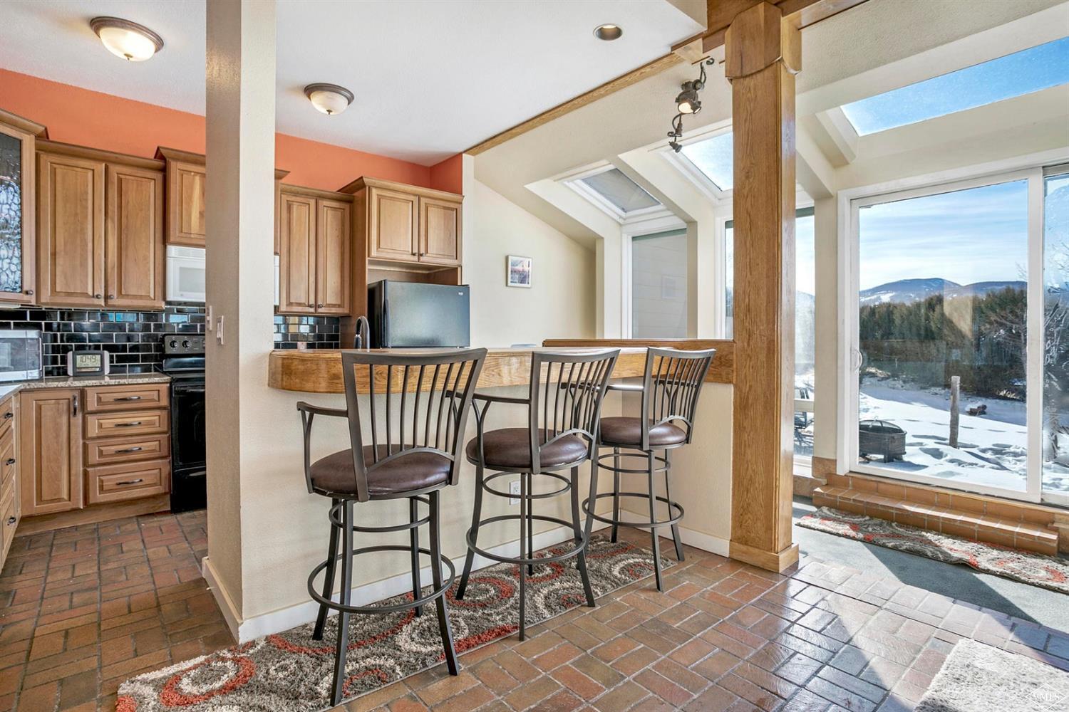 2613 Bear Trap Road Avon, CO 81620 - Photo 6 of 25 a view of a chairs and table in the balcony