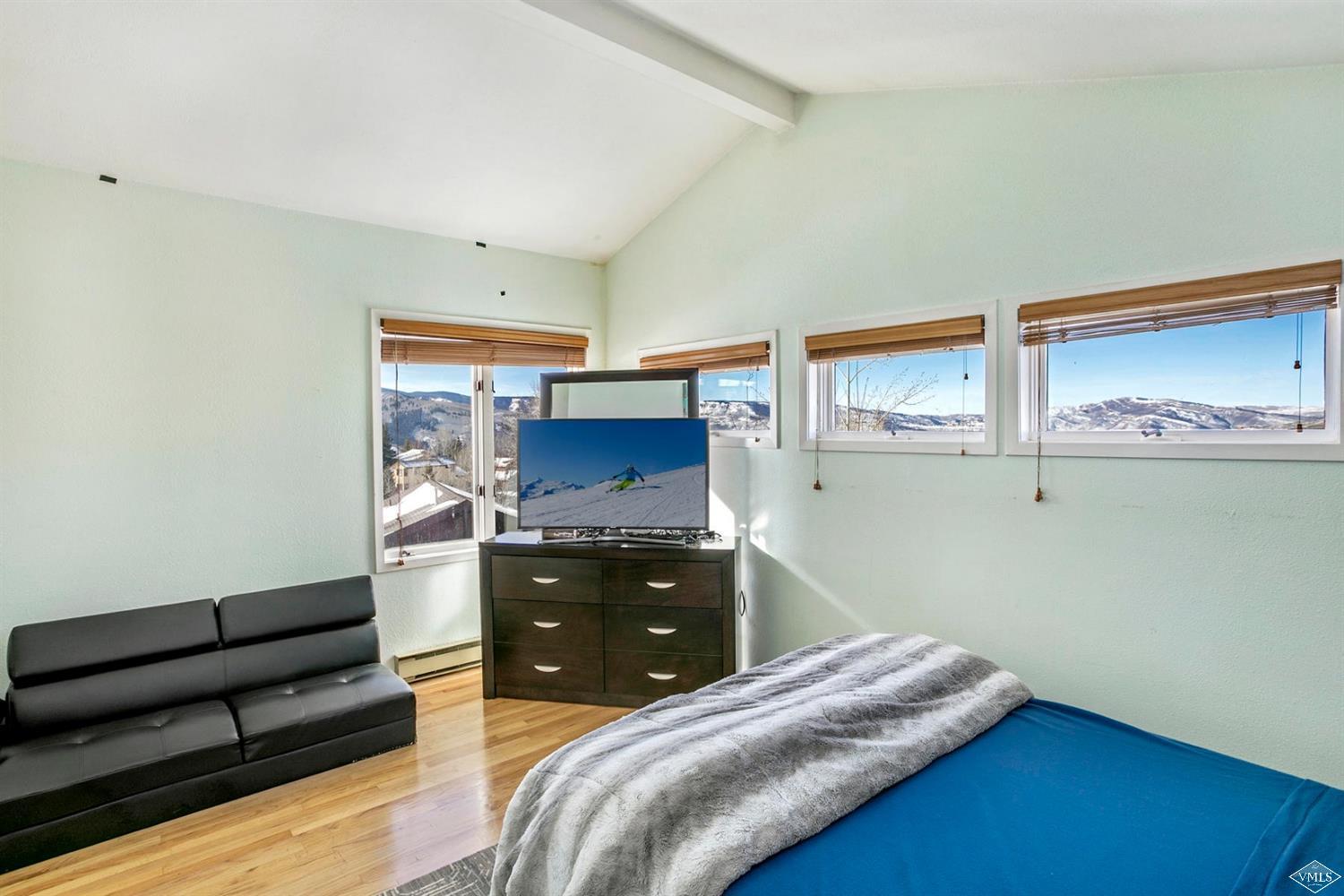 2613 Bear Trap Road Avon, CO 81620 - Photo 9 of 25 a bedroom with a bed and dresser