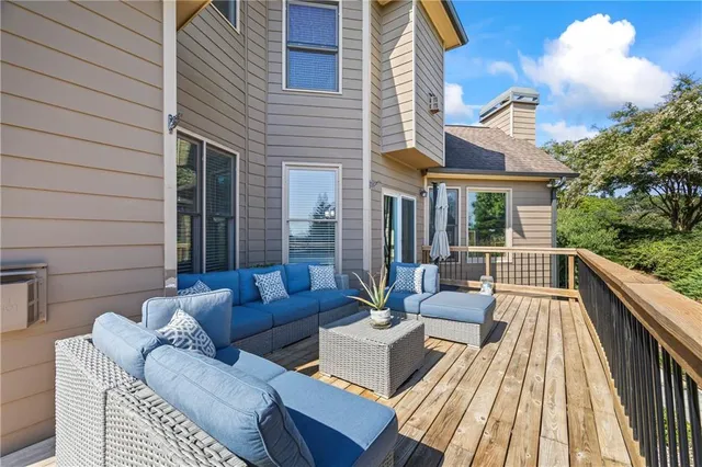 a backyard of a house with barbeque oven table and chairs