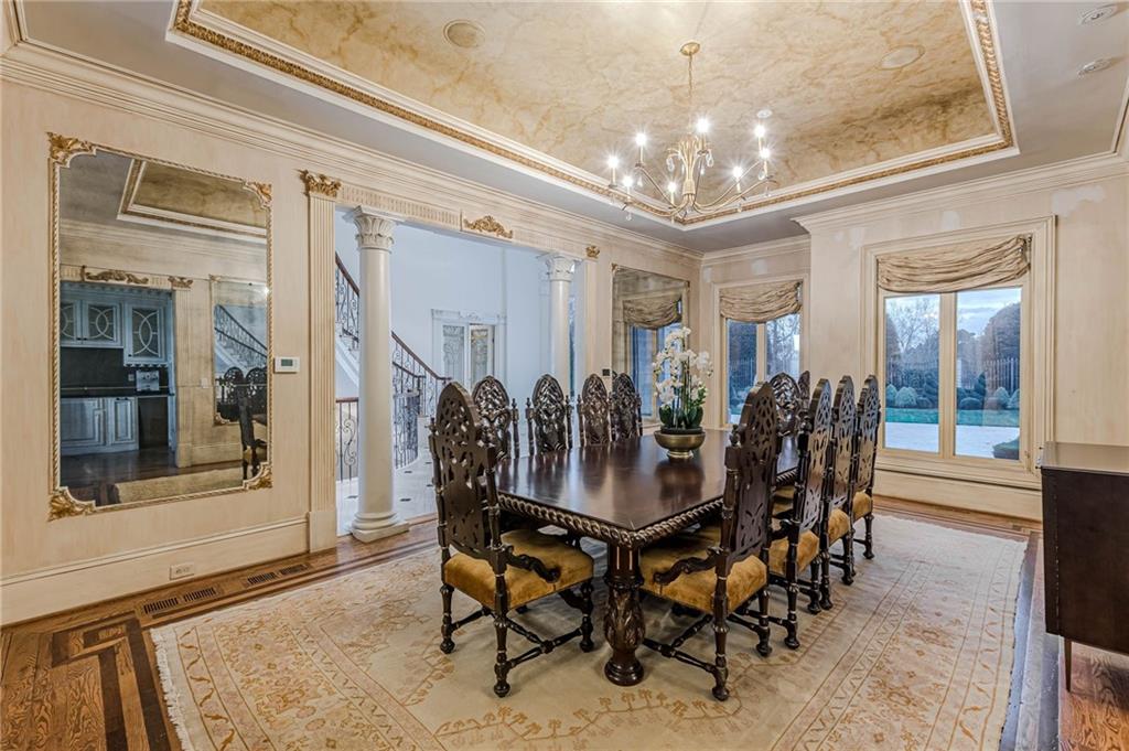 8330 Jett Ferry Road Sandy Springs, GA 30350 - Photo 13 of 98 a view of a dining room with furniture and chandelier