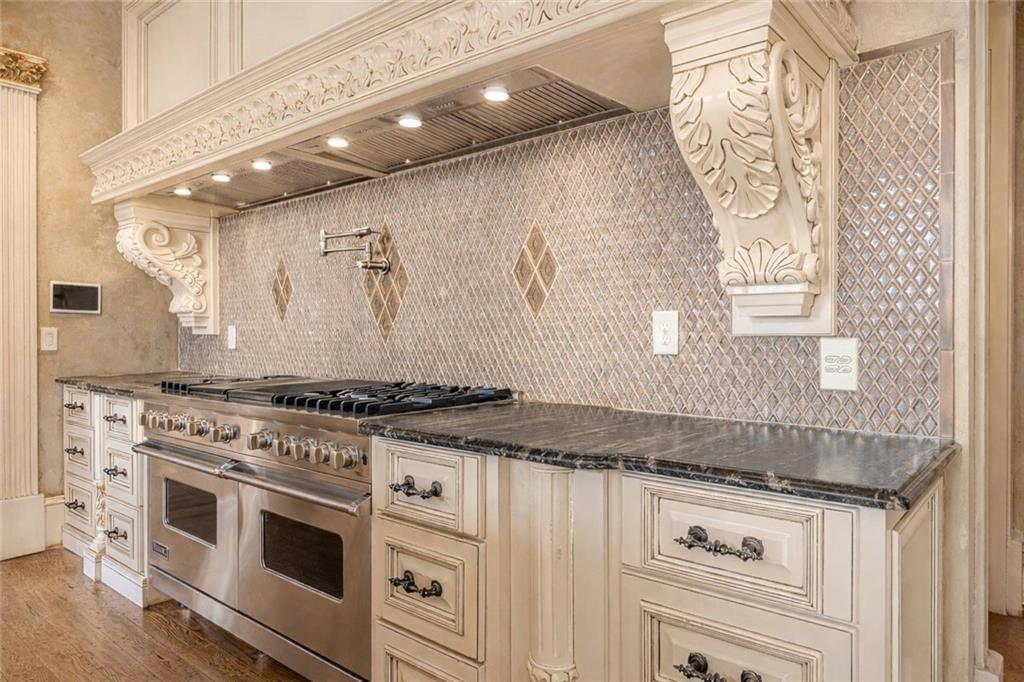 8330 Jett Ferry Road Sandy Springs, GA 30350 - Photo 15 of 98 a stove top oven sitting inside of a kitchen