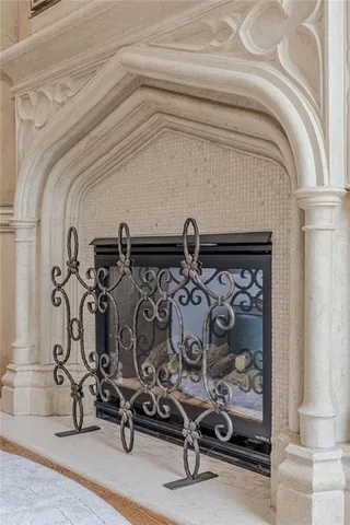 a spacious bedroom with a bed a couch and a large window