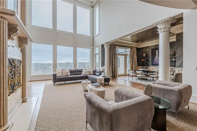 a bedroom with furniture and a chandelier