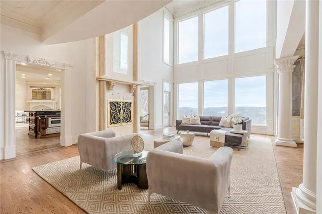 a living room with furniture and a chandelier