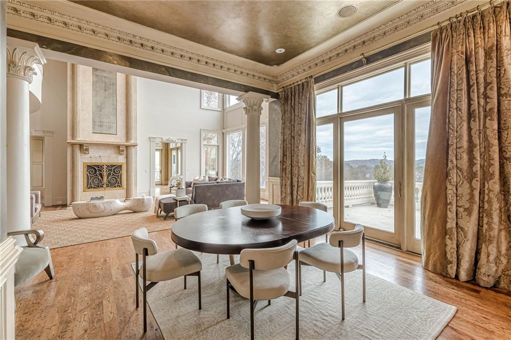8330 Jett Ferry Road Sandy Springs, GA 30350 - Photo 28 of 98 a view of a dining room with furniture window and wooden floor