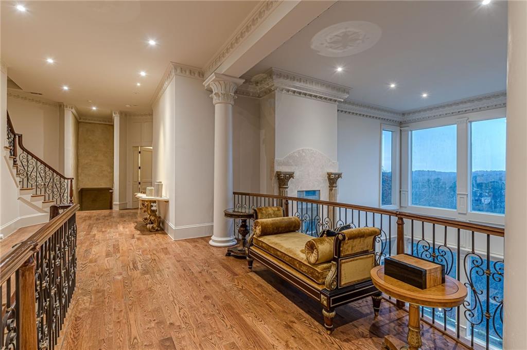 8330 Jett Ferry Road Sandy Springs, GA 30350 - Photo 31 of 98 a spacious bedroom with a bed a couch and a large window