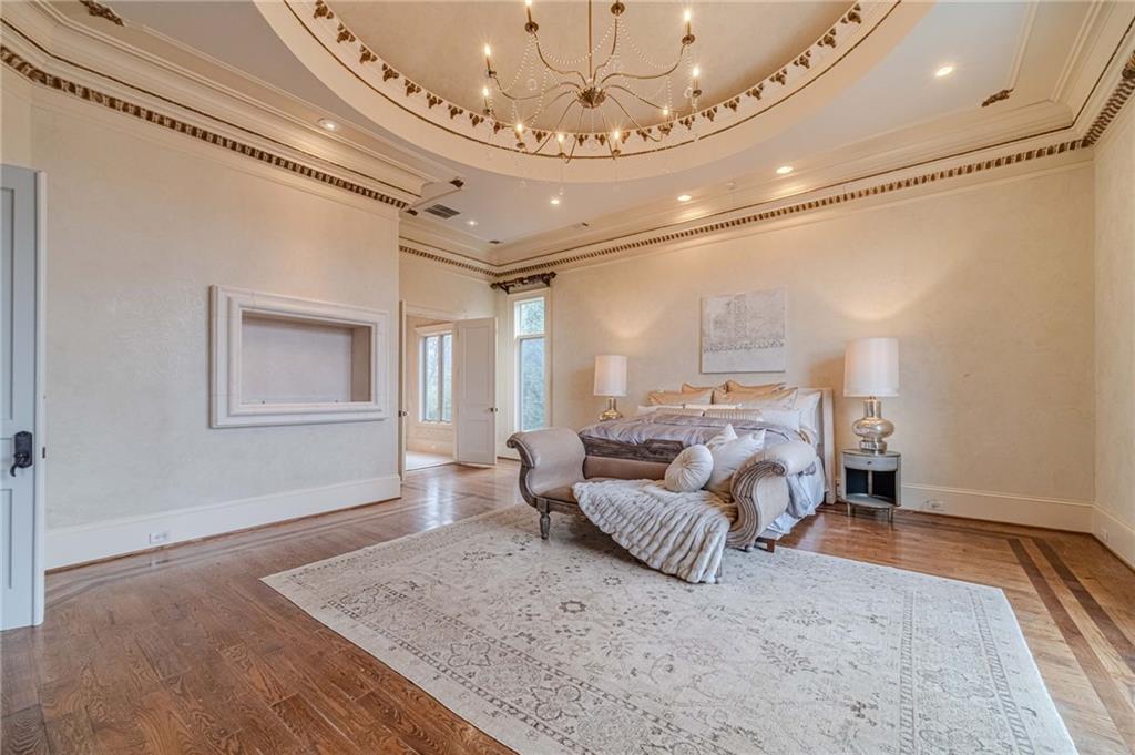 8330 Jett Ferry Road Sandy Springs, GA 30350 - Photo 34 of 98 a living room with furniture and a chandelier