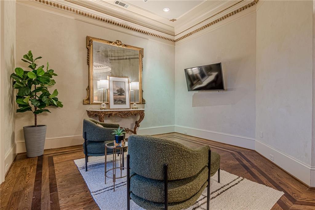 8330 Jett Ferry Road Sandy Springs, GA 30350 - Photo 36 of 98 a living room with furniture and a potted plant