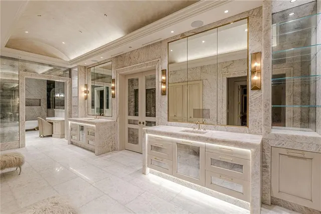 a living room with furniture a couch and a potted plant