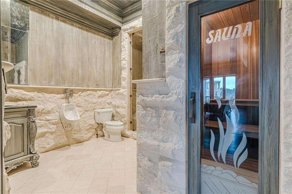 8330 Jett Ferry Road Sandy Springs, GA 30350 - Photo 59 of 98 a bathroom with a granite countertop shower and a sink