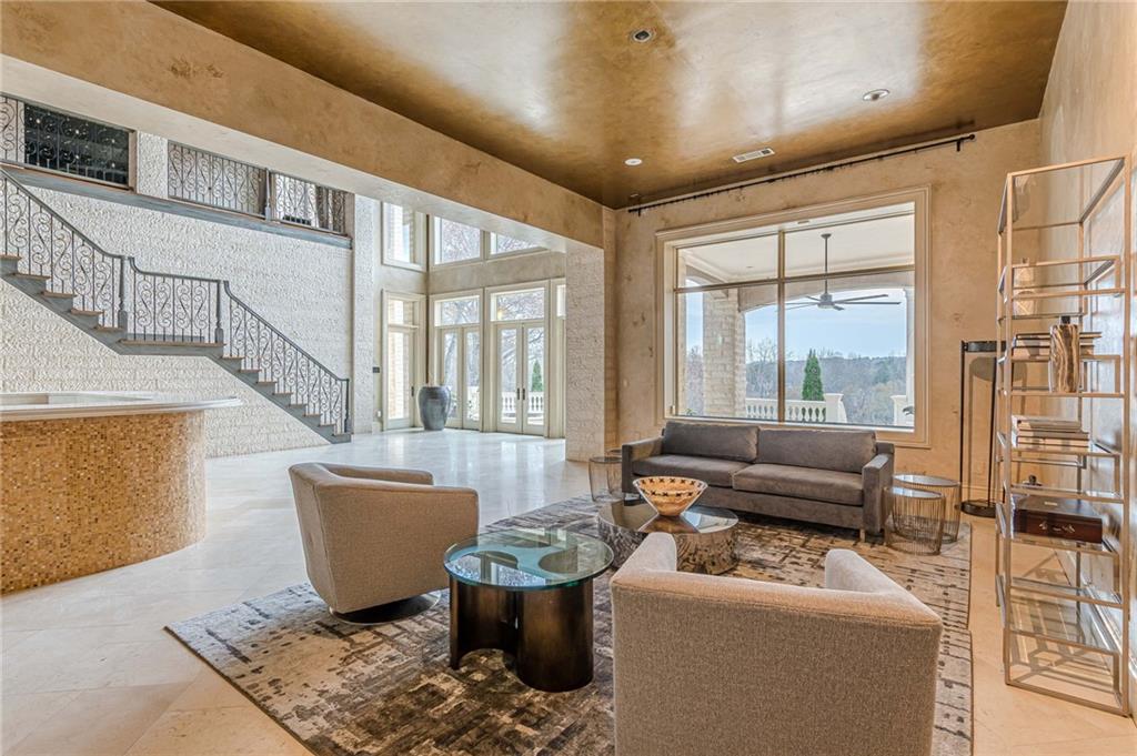 8330 Jett Ferry Road Sandy Springs, GA 30350 - Photo 65 of 98 a living room with furniture a couch and a potted plant