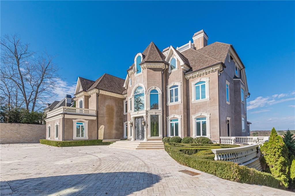 8330 Jett Ferry Road Sandy Springs, GA 30350 - Photo 68 of 98 a front view of a house with a yard