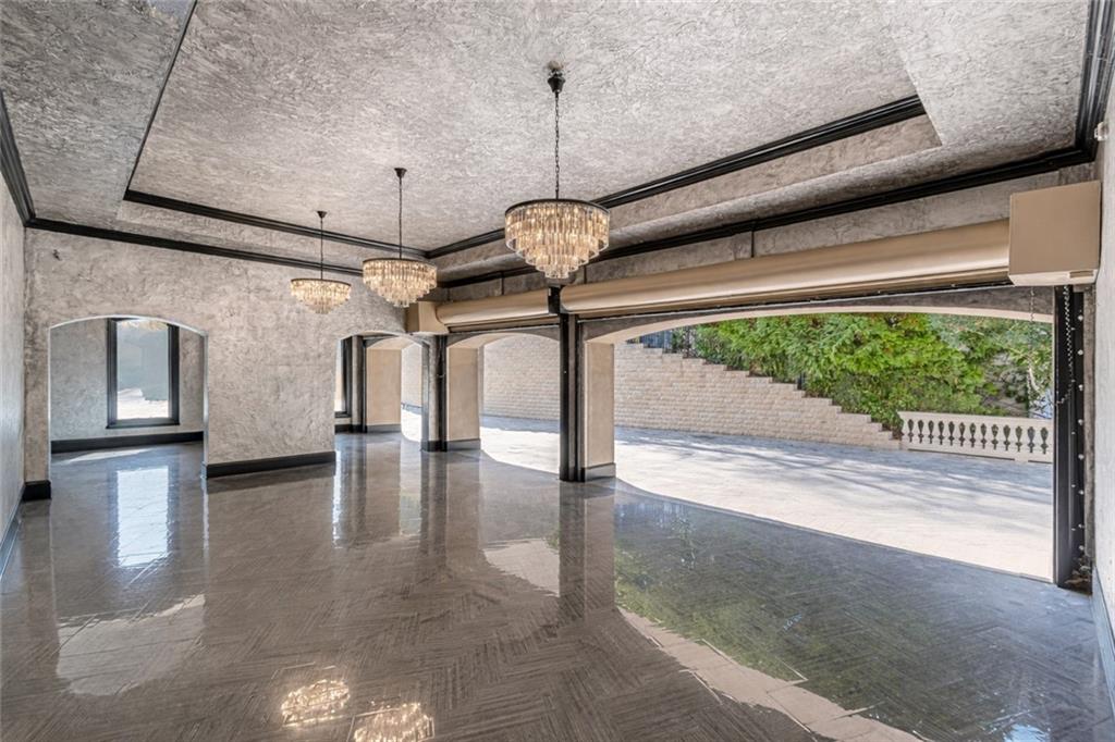 8330 Jett Ferry Road Sandy Springs, GA 30350 - Photo 75 of 98 a view of empty room with floor to ceiling window and outdoor space