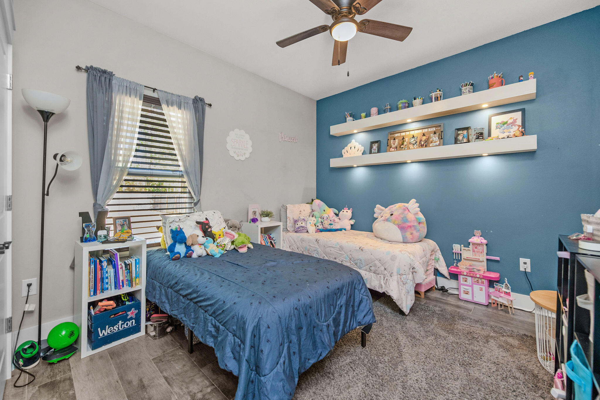 8914 Timber Lane Navarre, FL 32566 - Photo 26 of 40 a bedroom with bed and a chandelier