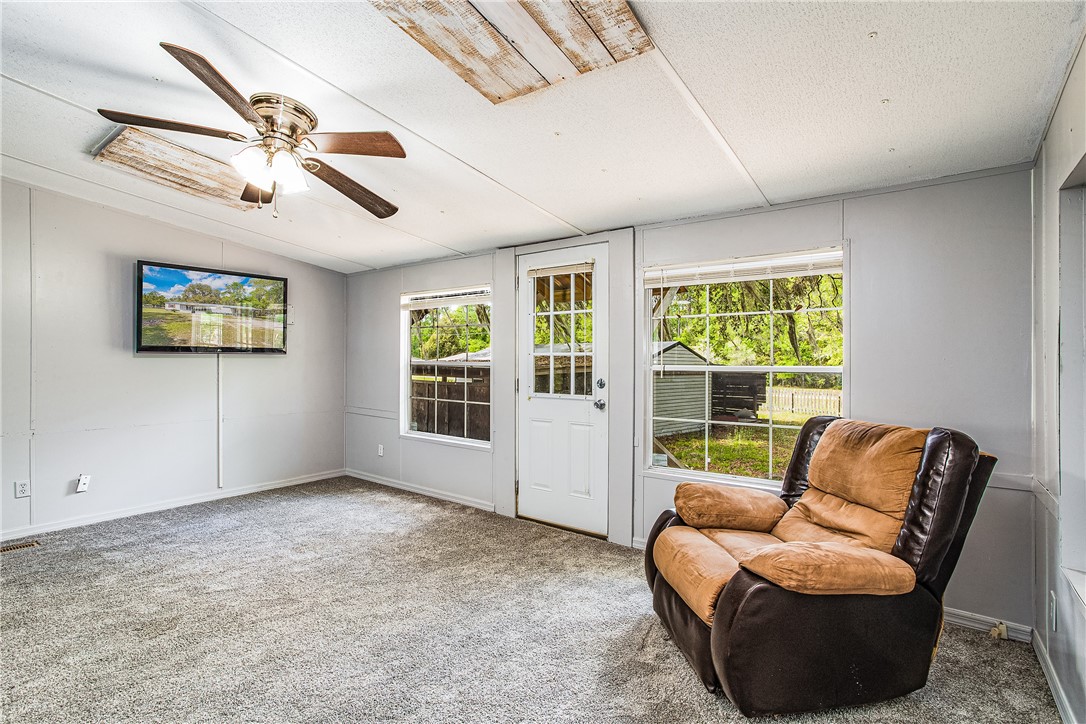 35157 Goodbread Road Callahan, FL 32011 - Photo 17 of 34 a living room with furniture and a large window