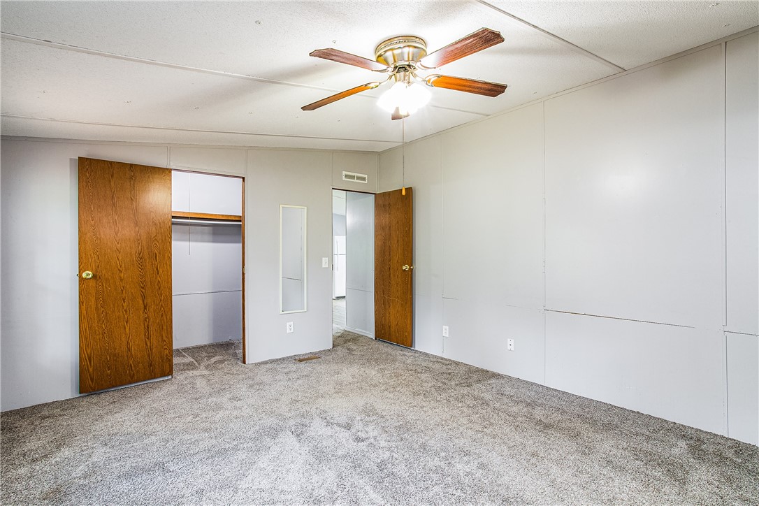35157 Goodbread Road Callahan, FL 32011 - Photo 20 of 34 an empty room with closet and a chandelier fan