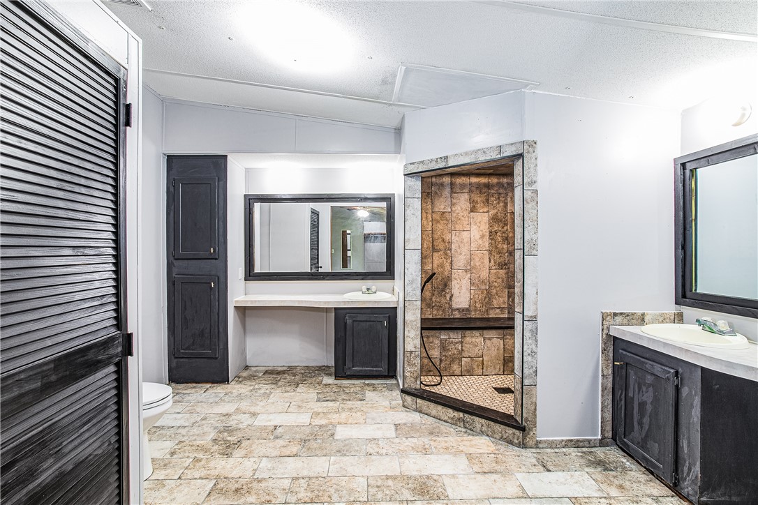 35157 Goodbread Road Callahan, FL 32011 - Photo 22 of 34 a view of a hallway to kitchen and entryway with wooden floor