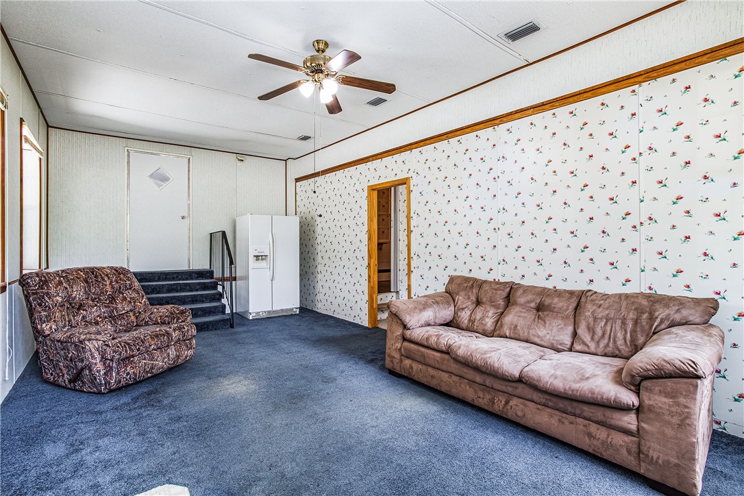 35157 Goodbread Road Callahan, FL 32011 - Photo 25 of 34 a living room with furniture and a chandelier