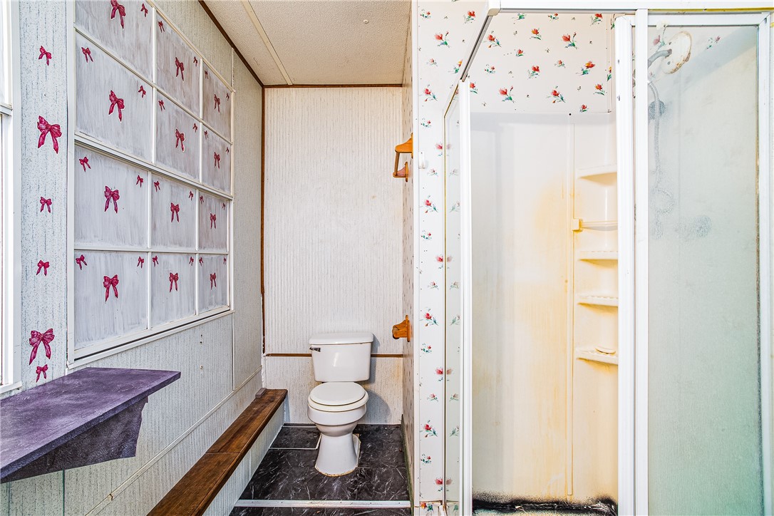 35157 Goodbread Road Callahan, FL 32011 - Photo 27 of 34 a white toilet sitting next to a bathroom sink