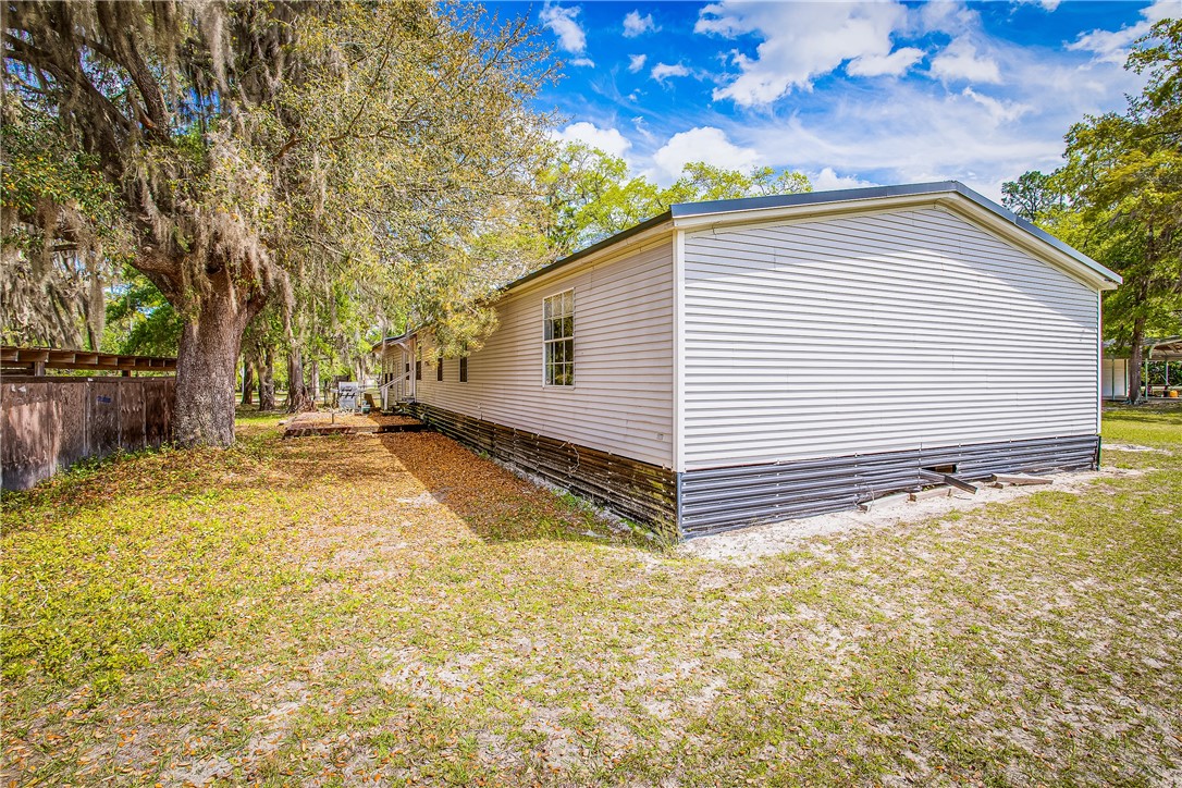 35157 Goodbread Road Callahan, FL 32011 - Photo 28 of 34 a backyard of a house