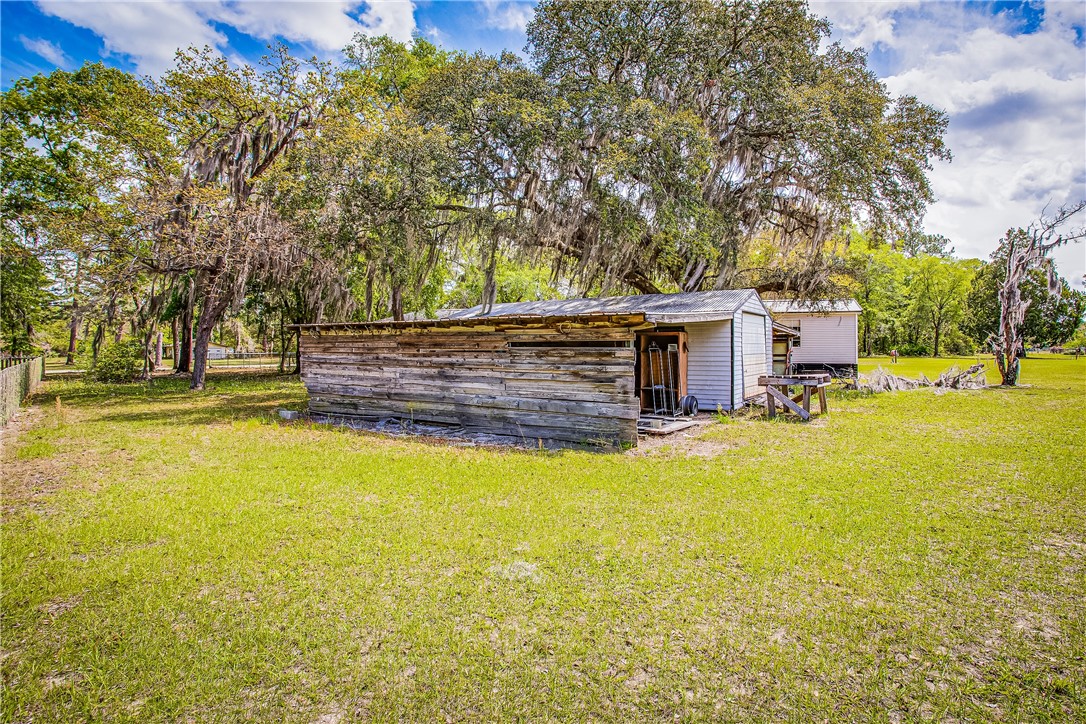 35157 Goodbread Road Callahan, FL 32011 - Photo 29 of 34 a view of a house with pool and tree s
