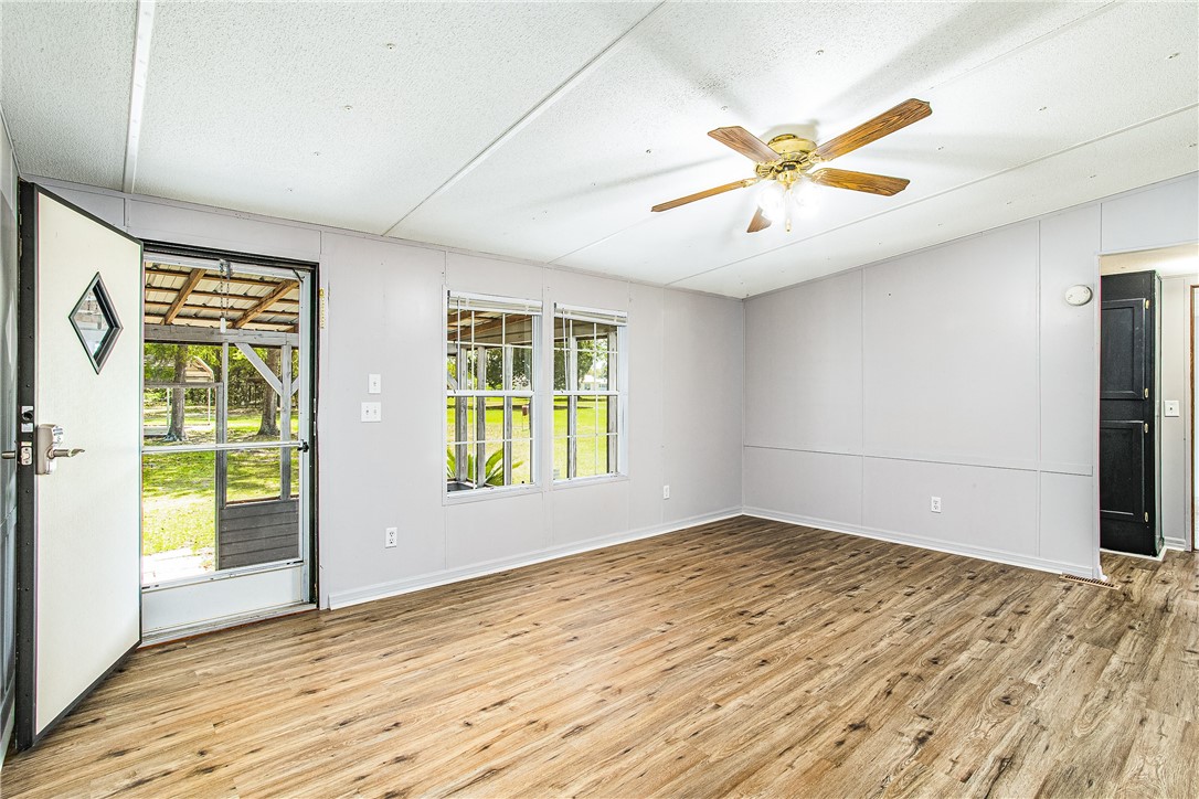 35157 Goodbread Road Callahan, FL 32011 - Photo 6 of 34 an empty room with windows and entrance