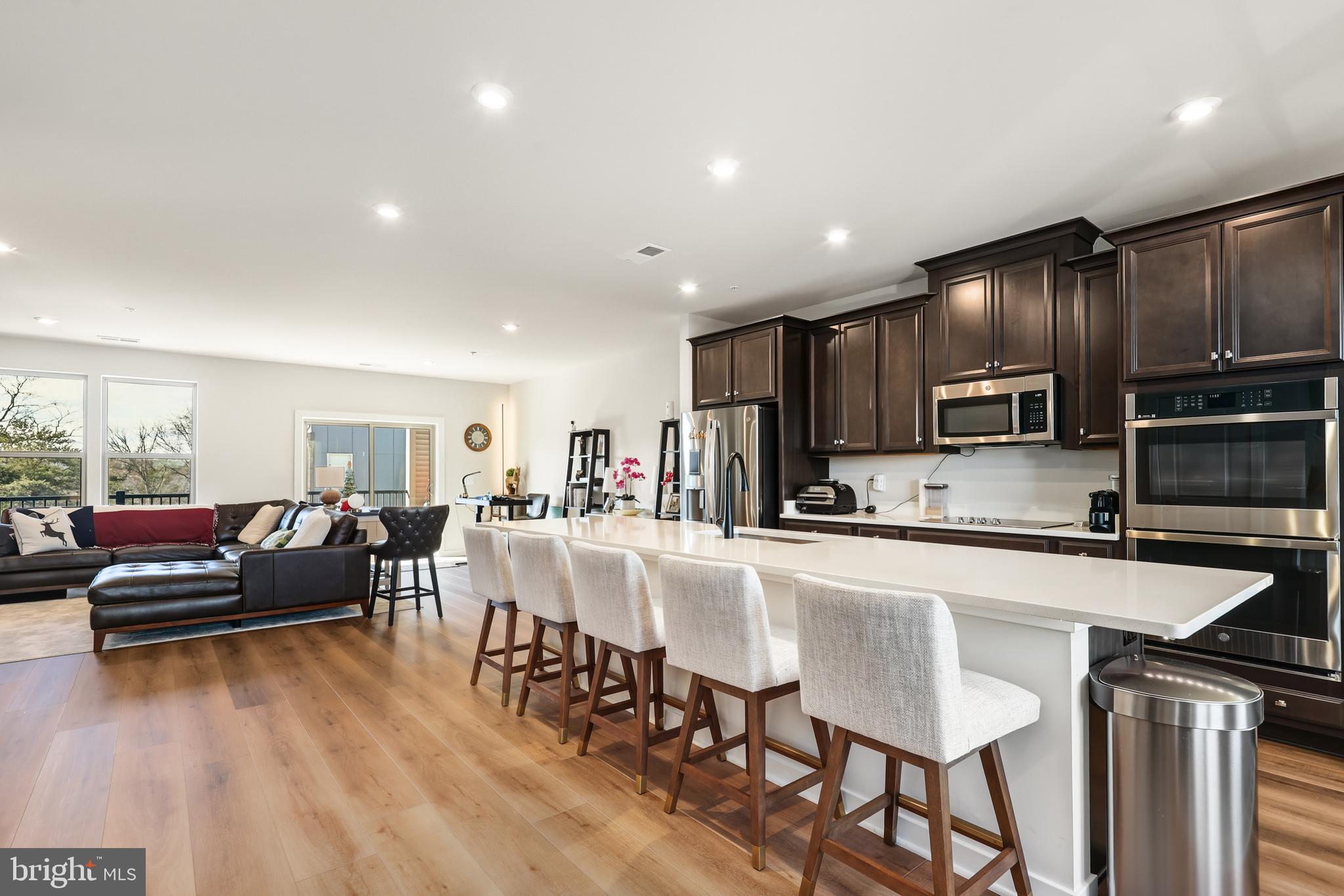 a large kitchen with a table and chairs