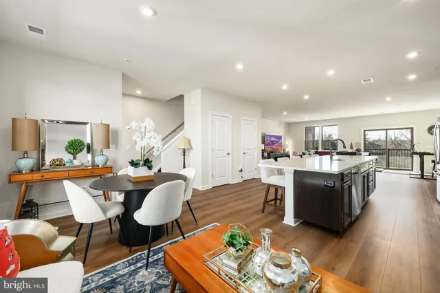 a kitchen with counter top space a sink appliances and cabinets