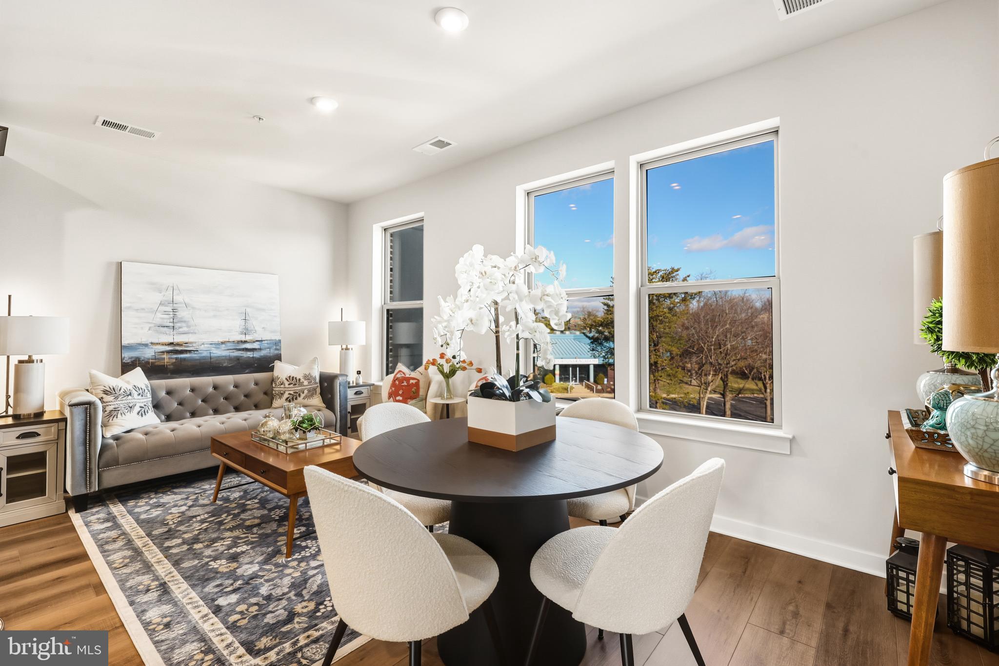 13508 INNOVATION Sta Loop, Unit 3B Herndon, VA 20171 - Photo 12 of 28 a living room with furniture and a table