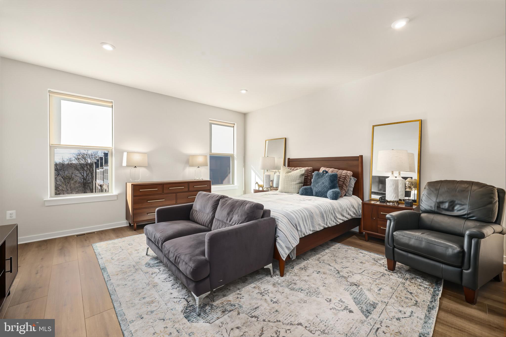 13508 INNOVATION Sta Loop, Unit 3B Herndon, VA 20171 - Photo 14 of 28 a bedroom with a bed couch and wooden floor