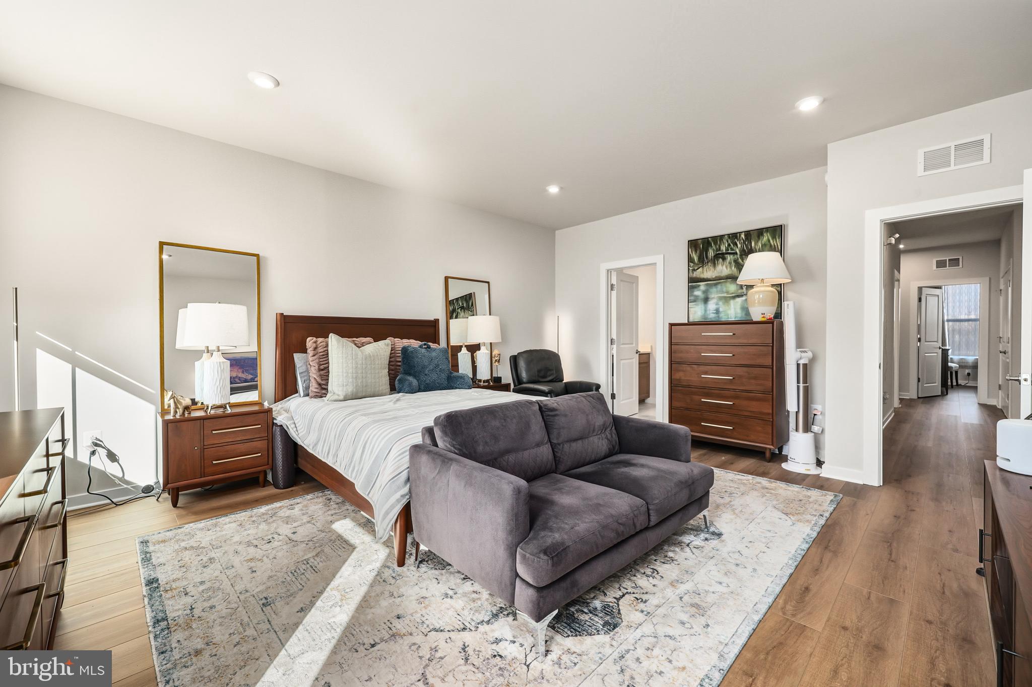 13508 INNOVATION Sta Loop, Unit 3B Herndon, VA 20171 - Photo 15 of 28 a bedroom with furniture and wooden floor