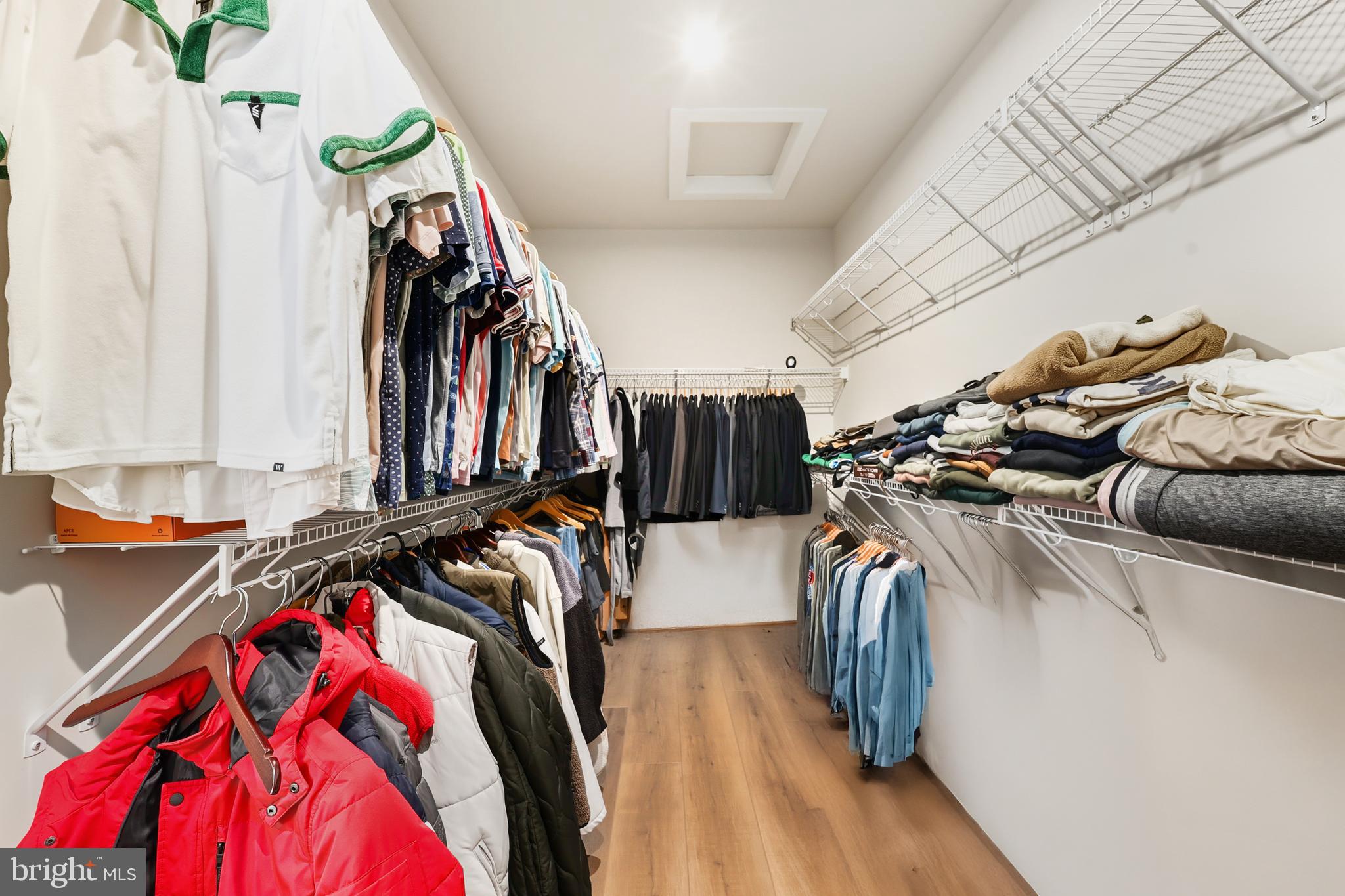 13508 INNOVATION Sta Loop, Unit 3B Herndon, VA 20171 - Photo 17 of 28 a view of walk in closet with clothes and shoes