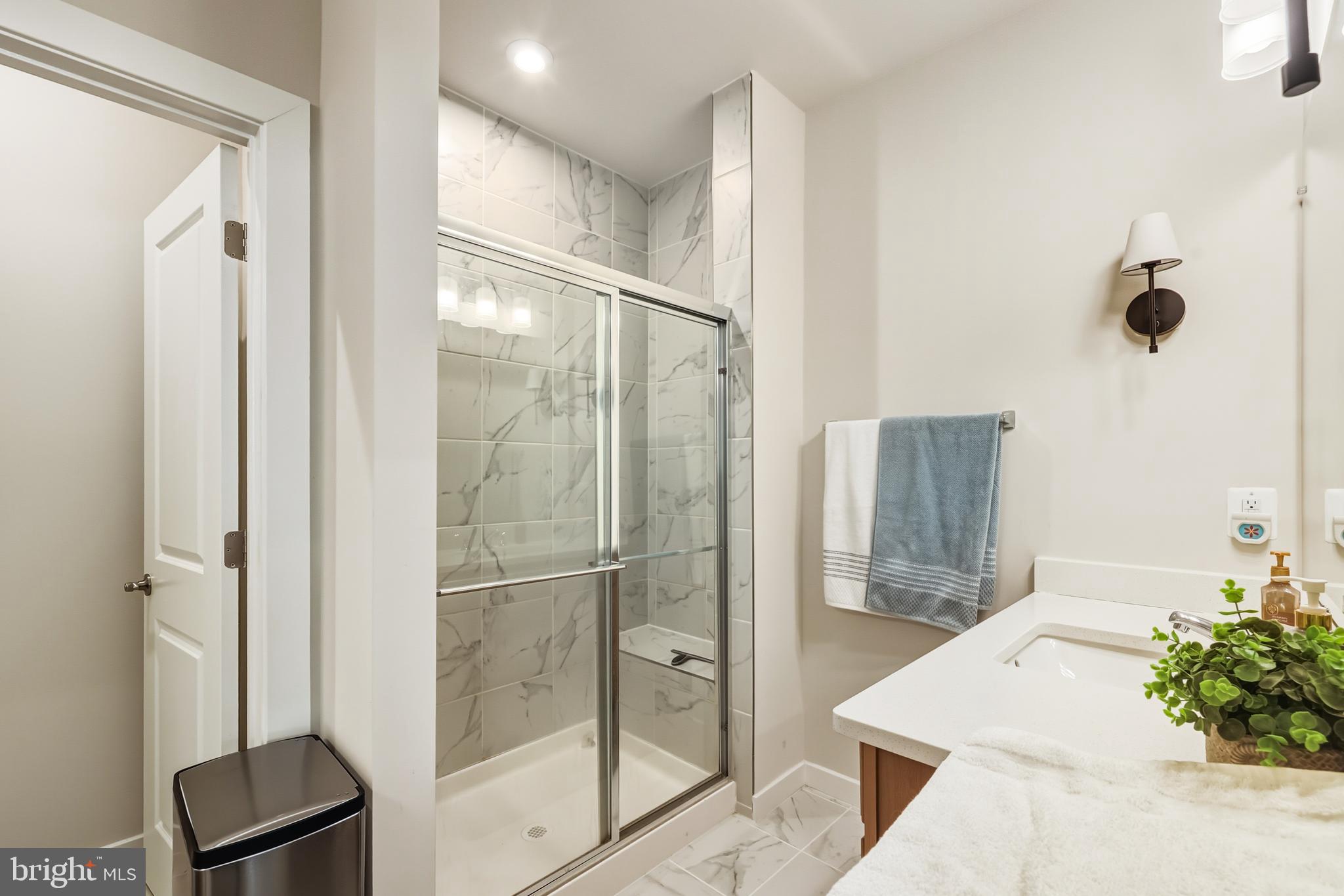 13508 INNOVATION Sta Loop, Unit 3B Herndon, VA 20171 - Photo 21 of 28 a bathroom with a bathtub and a shower