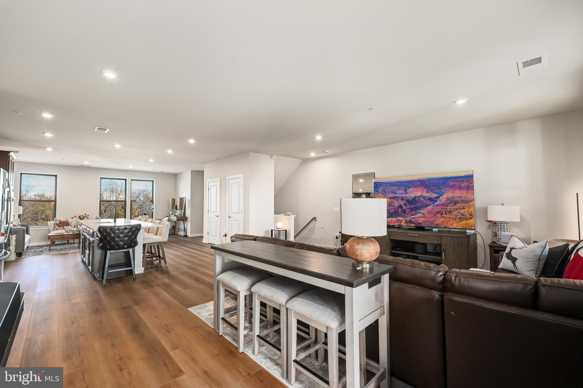13508 INNOVATION Sta Loop, Unit 3B Herndon, VA 20171 - Photo 7 of 28 a living room with furniture and wooden floor