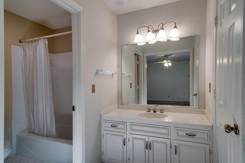 944 General George Patton Road, Unit 944 Nashville, TN 37221 - Photo 11 of 17 a bathroom with a double vanity sink and a mirror