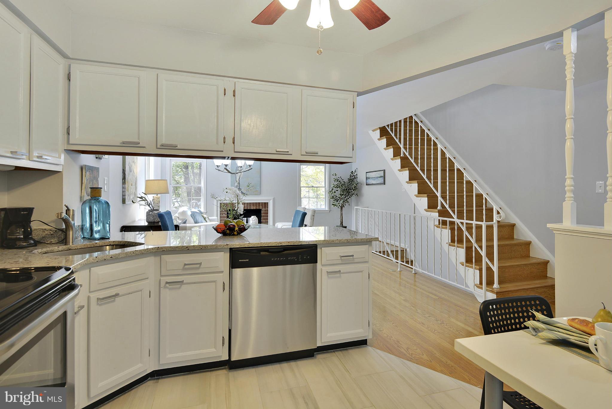 2059 South Glebe Road Arlington, VA 22206 - Photo 2 of 20 a kitchen with cabinets a sink and appliances