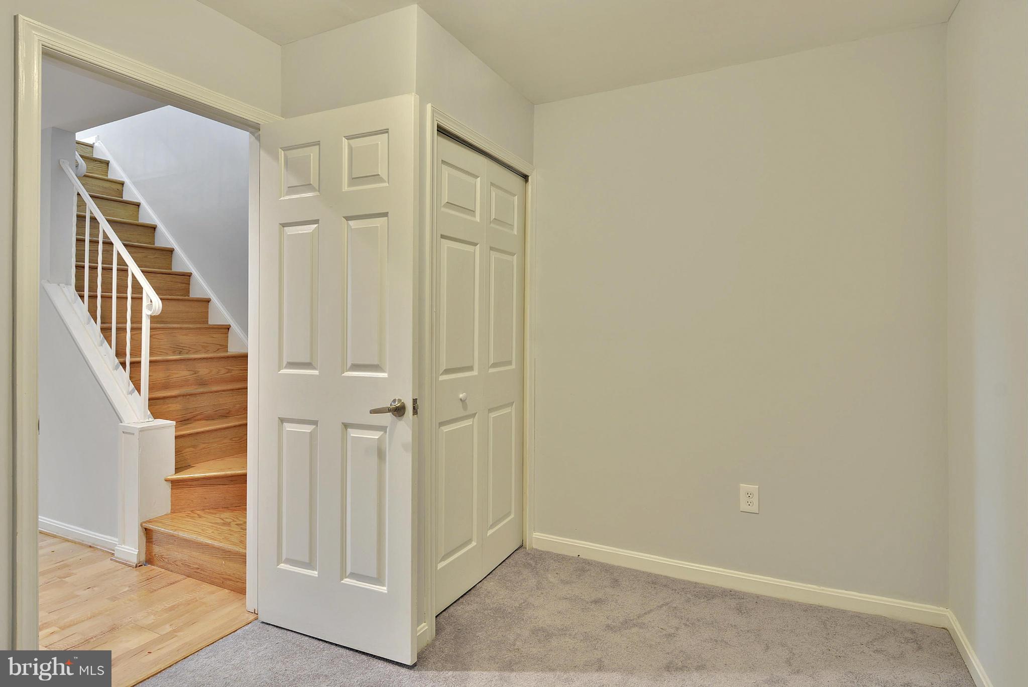 2059 South Glebe Road Arlington, VA 22206 - Photo 14 of 20 an entryway with wooden floor and staircase