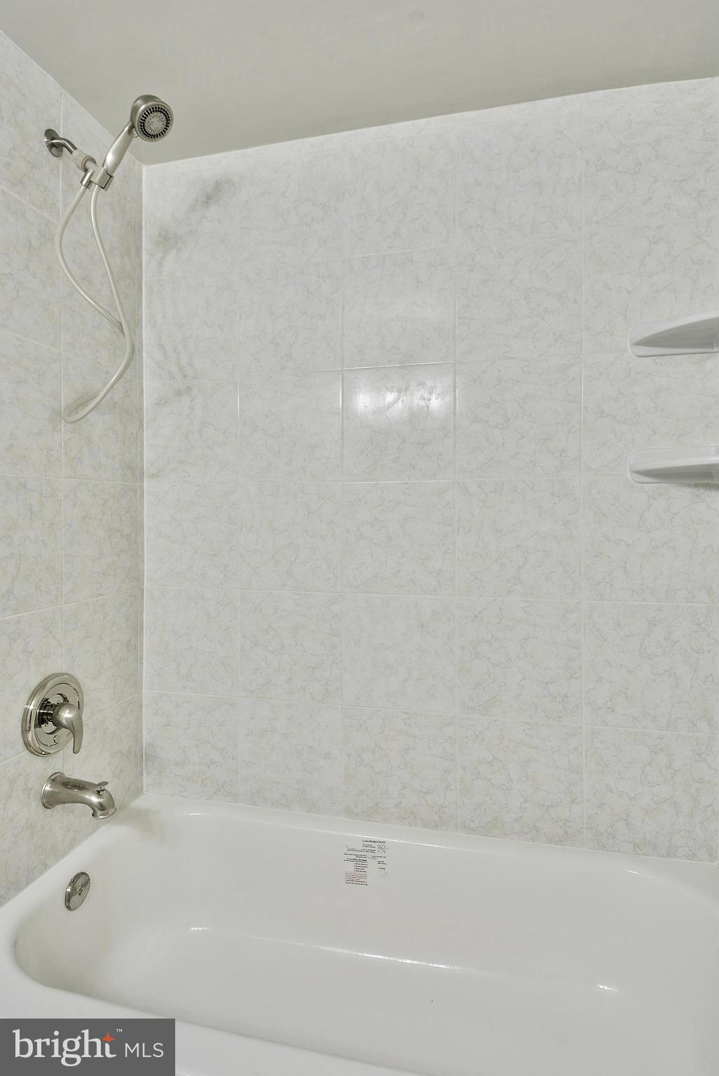 2059 South Glebe Road Arlington, VA 22206 - Photo 15 of 20 a bathroom with a bathtub and shower