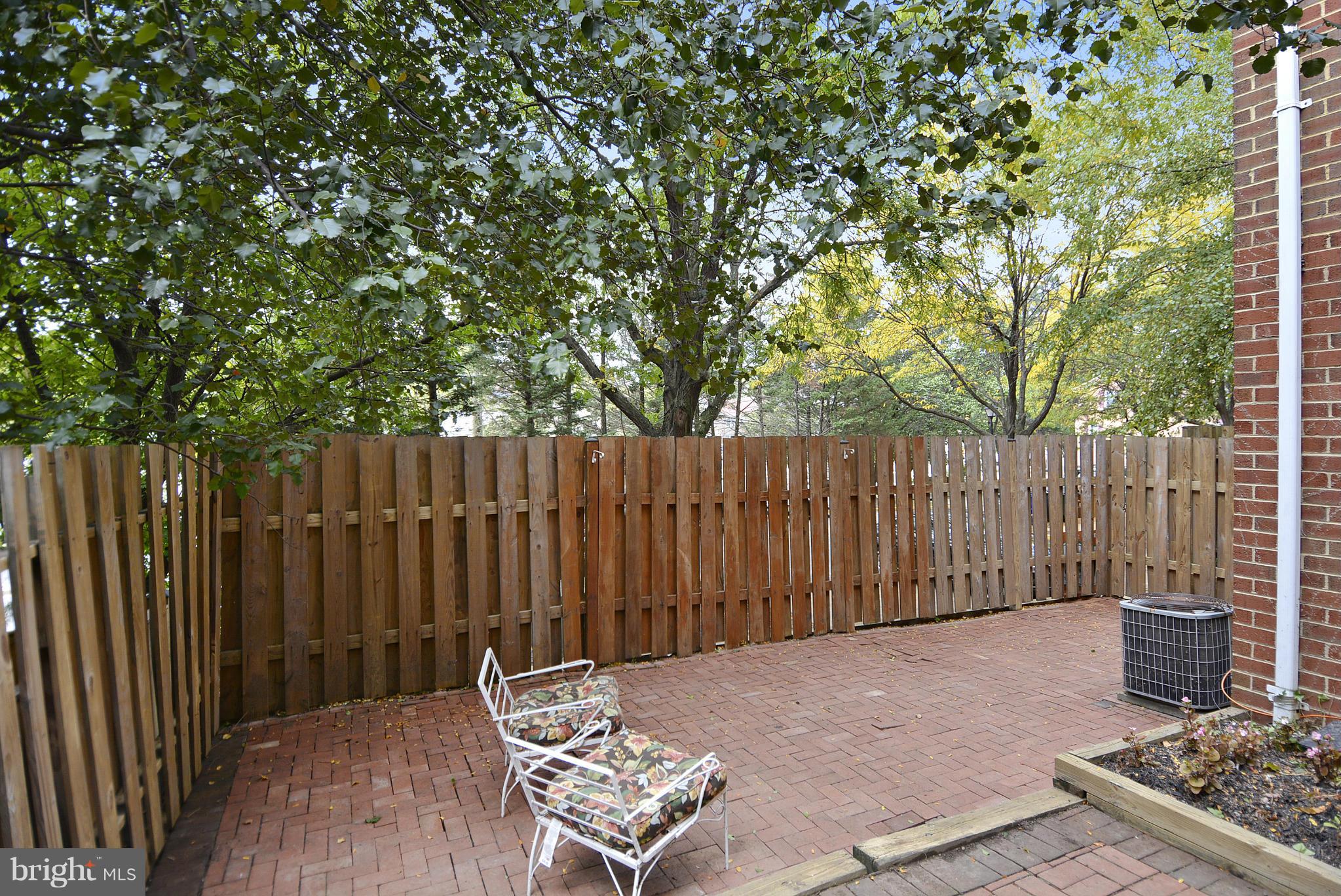 2059 South Glebe Road Arlington, VA 22206 - Photo 6 of 20 a backyard of a house with chairs and a fire pit
