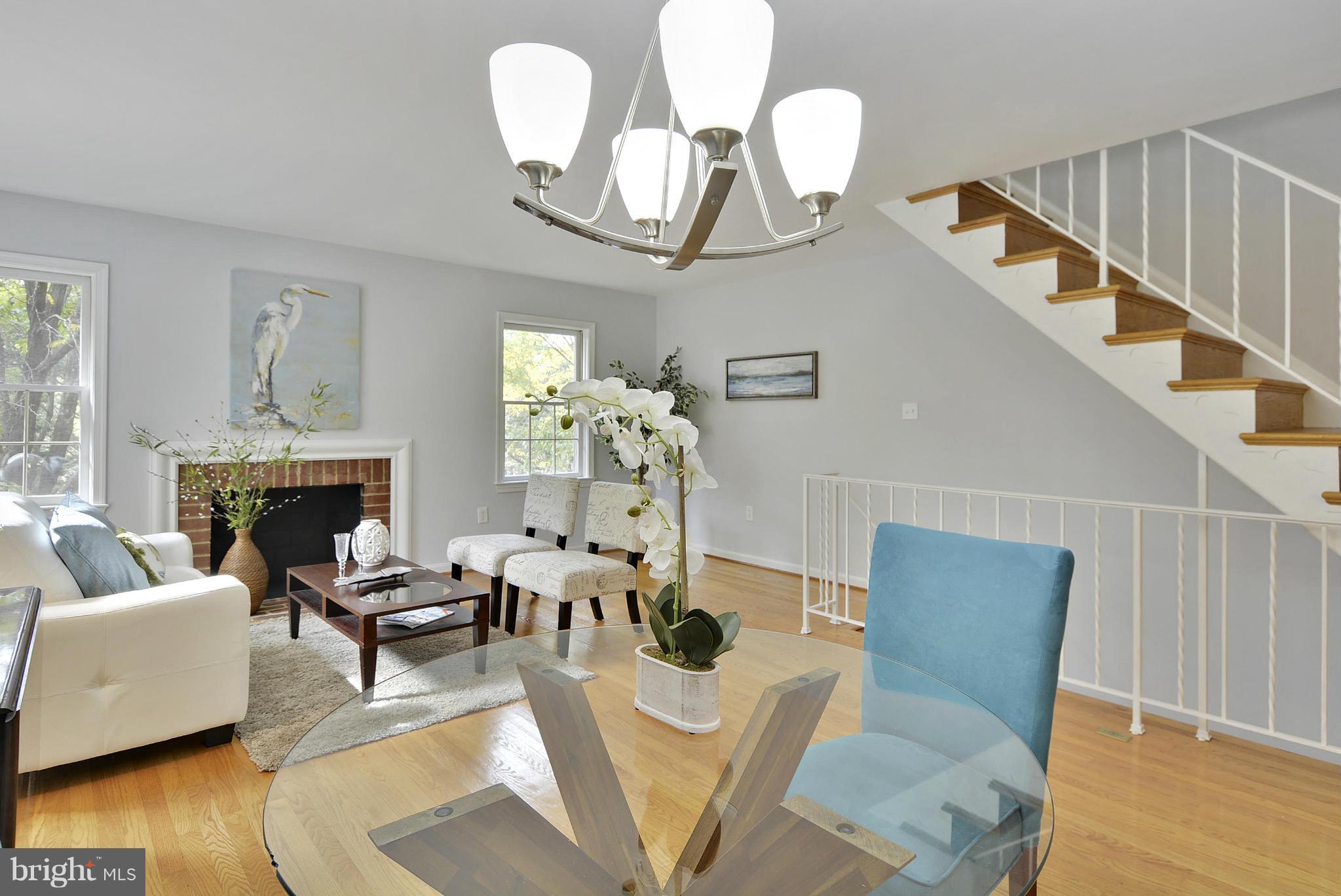 2059 South Glebe Road Arlington, VA 22206 - Photo 7 of 20 a living room with furniture chandelier and a fireplace
