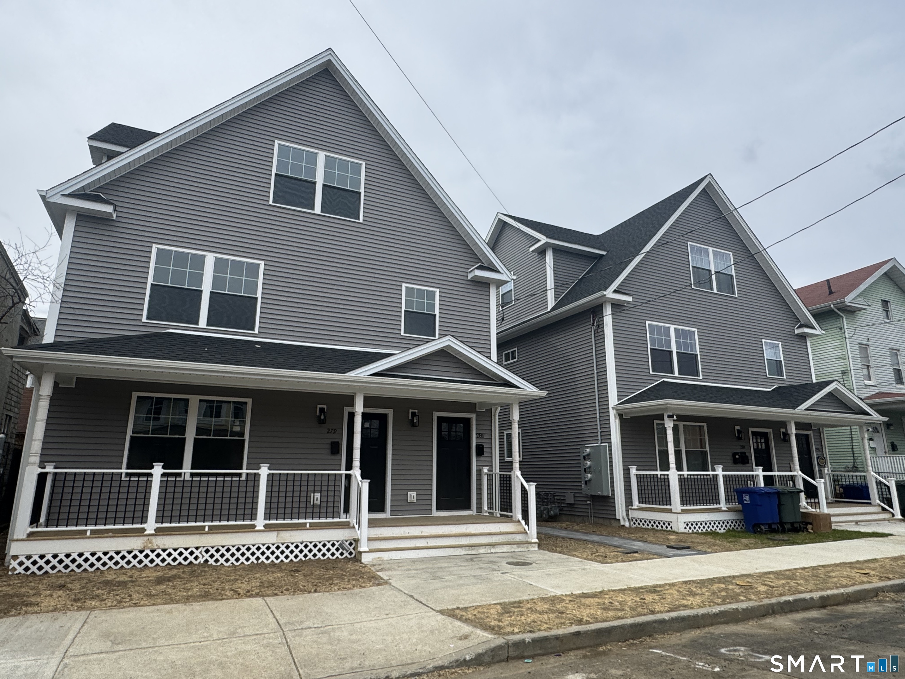 279 Harriet Street Bridgeport, CT 06608 - Photo 2 of 9 a front view of a house with a garage