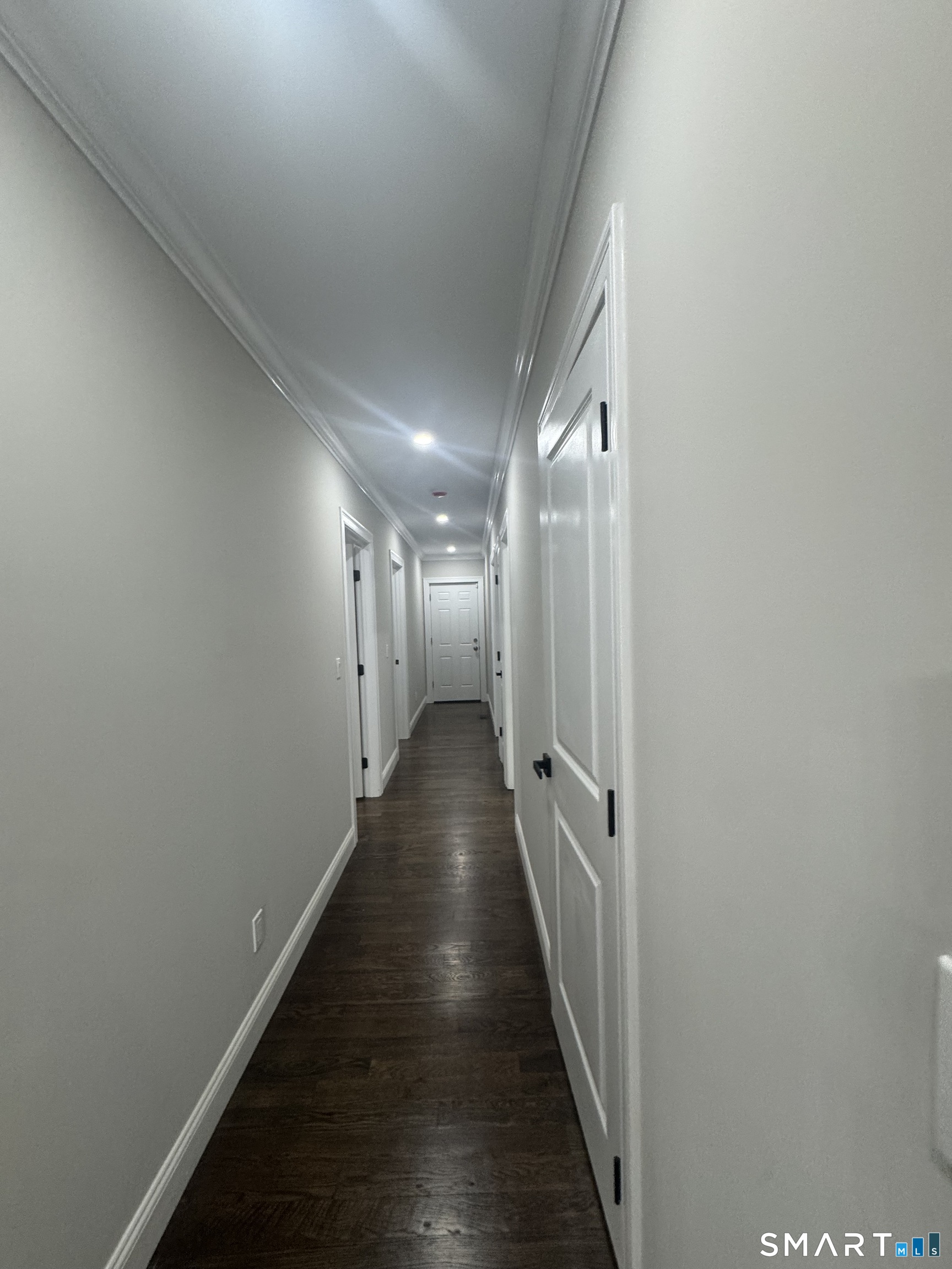 279 Harriet Street Bridgeport, CT 06608 - Photo 4 of 9 a view of a hallway with wooden floor