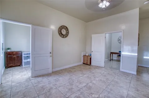 a view of a room that has a table and chairs