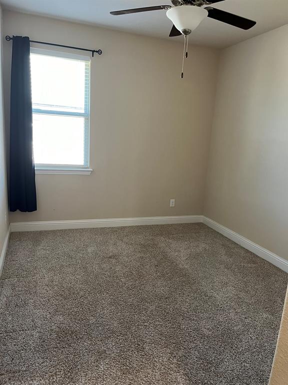 8 Pleasant Valley Sanger, TX 76266 - Photo 22 of 26 an empty room with a window