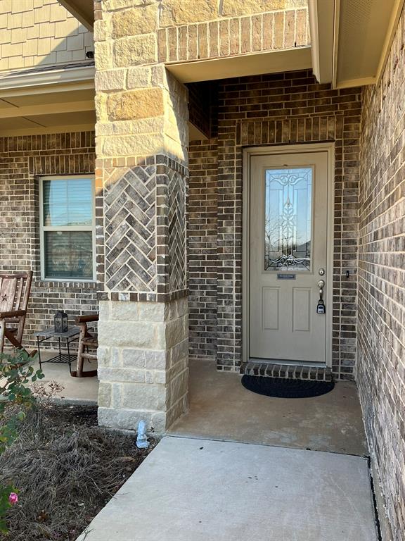 8 Pleasant Valley Sanger, TX 76266 - Photo 3 of 26 a front view of a house with a gate