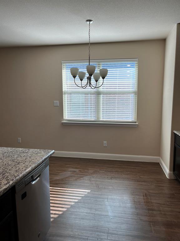 8 Pleasant Valley Sanger, TX 76266 - Photo 7 of 26 an empty room with wooden floor and windows
