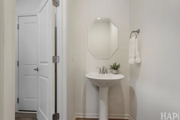 a bathroom with a sink a mirror and shower